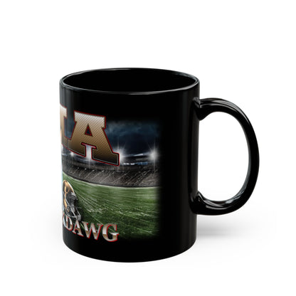 a black coffee mug with a picture of a football stadium