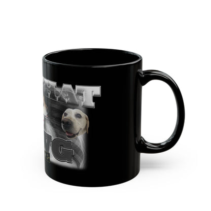 a black coffee mug with a picture of a dog