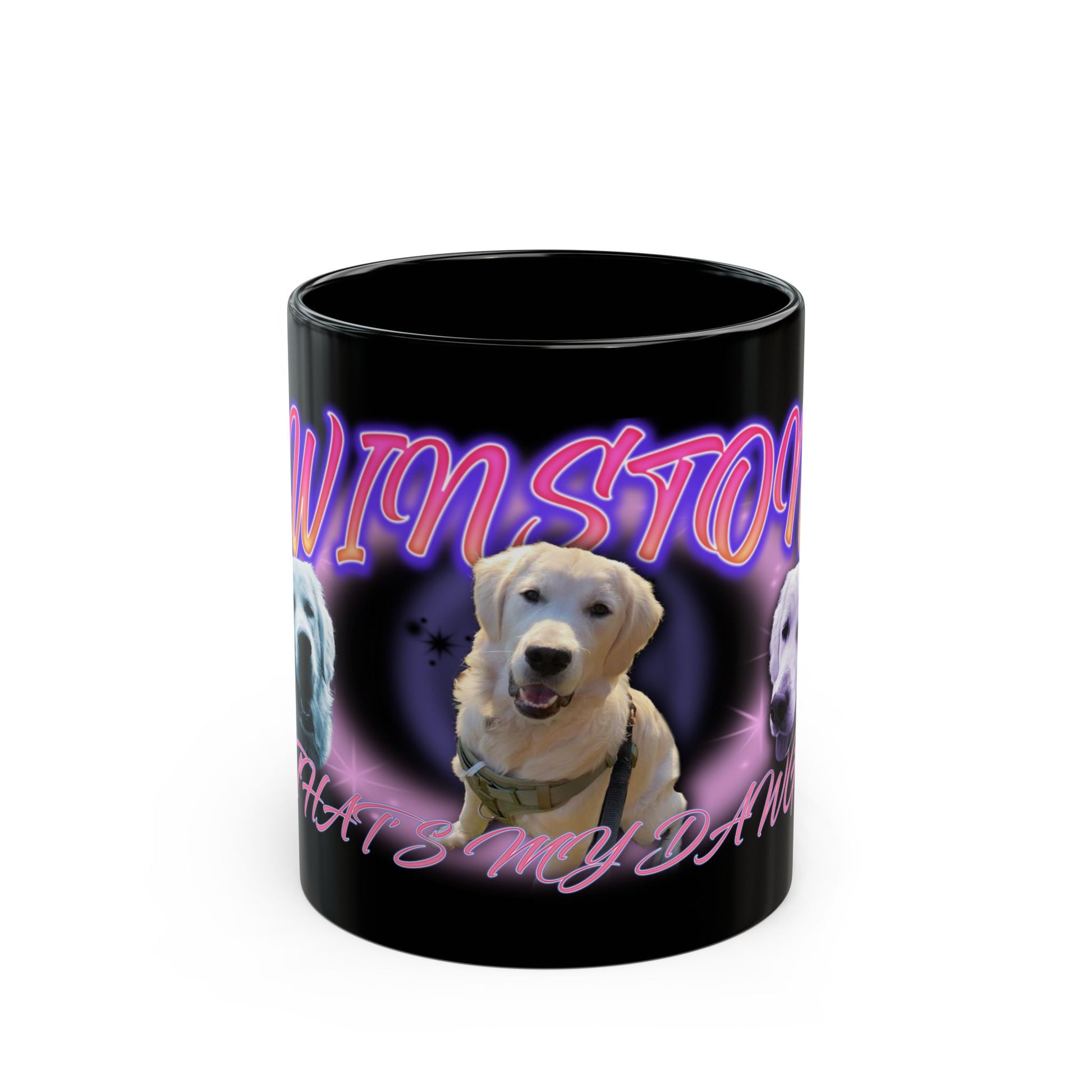 a black coffee mug with a picture of a dog