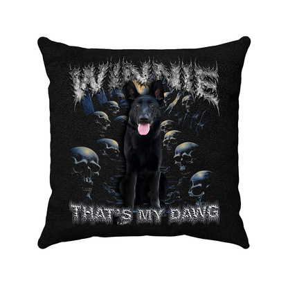 a black pillow with a black dog on it