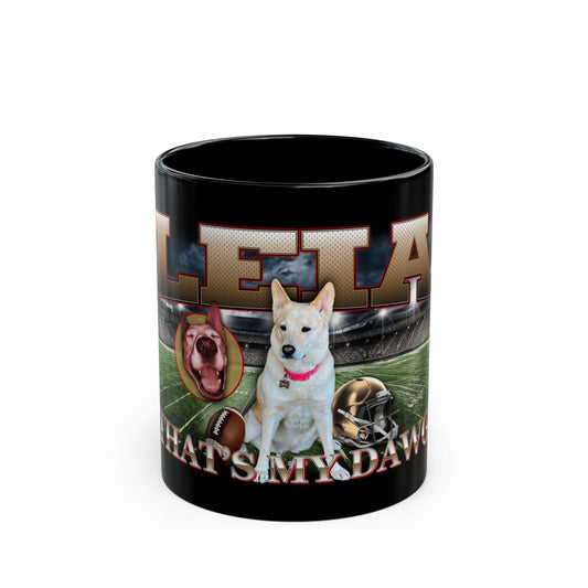 a black coffee mug with a picture of a dog on it